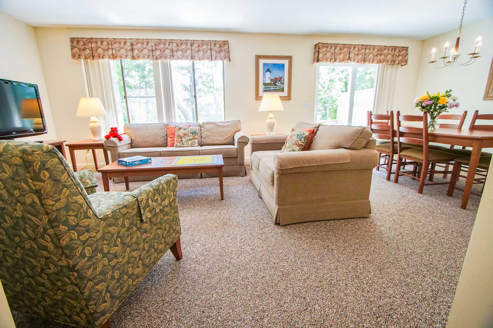 A cozy living and dining room area at VRI's Brewster Green Resort in Massachusetts.